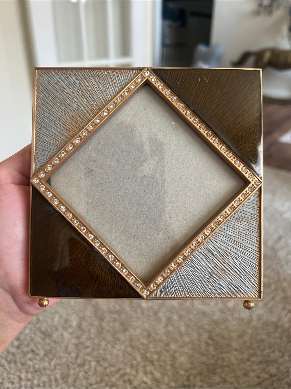 Z Gallerie picture frame features an enamel and crystal-decorated diamond border